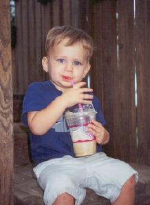 Paul drinking a shake at the park